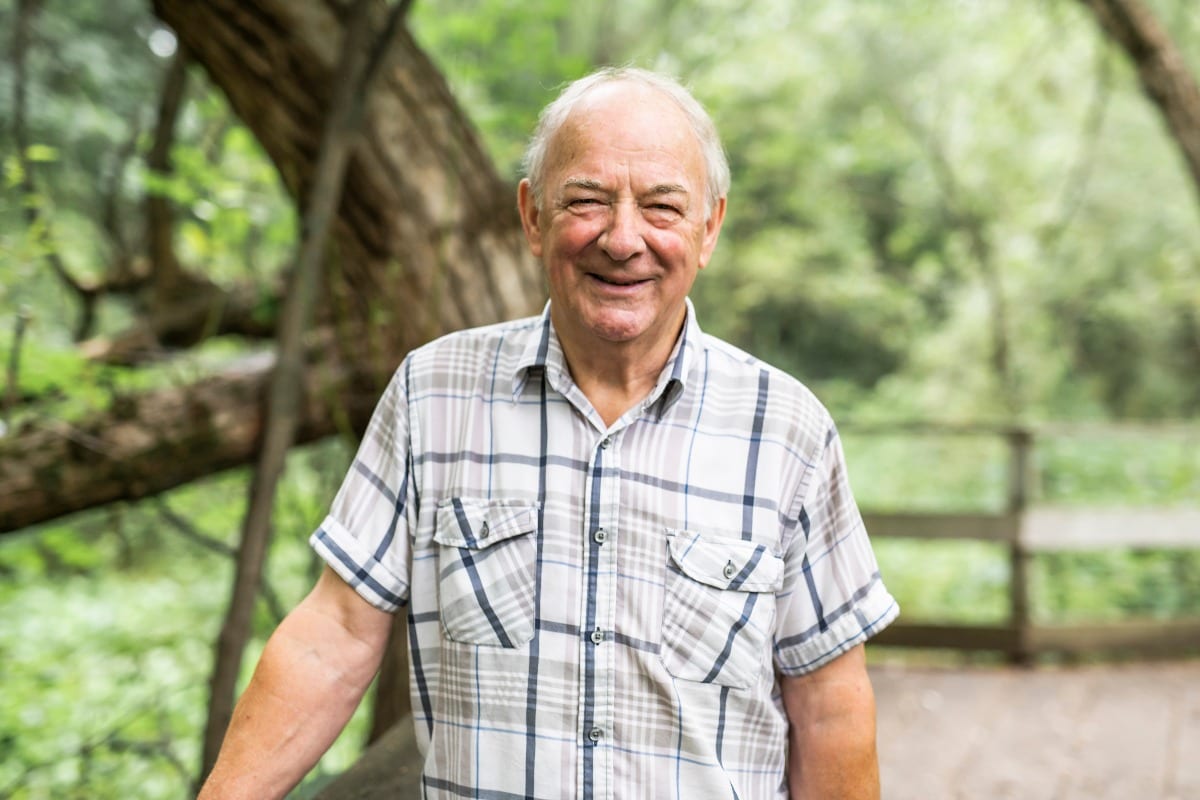 Senior man in the nice forest park