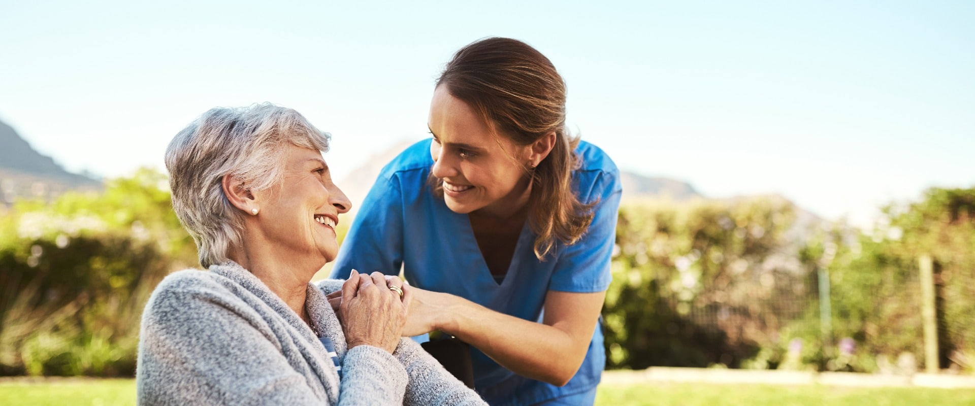 Some vitamin D is just what you need today. Cropped shot of a young female nurse outside with a senior patient in a wheelchair.